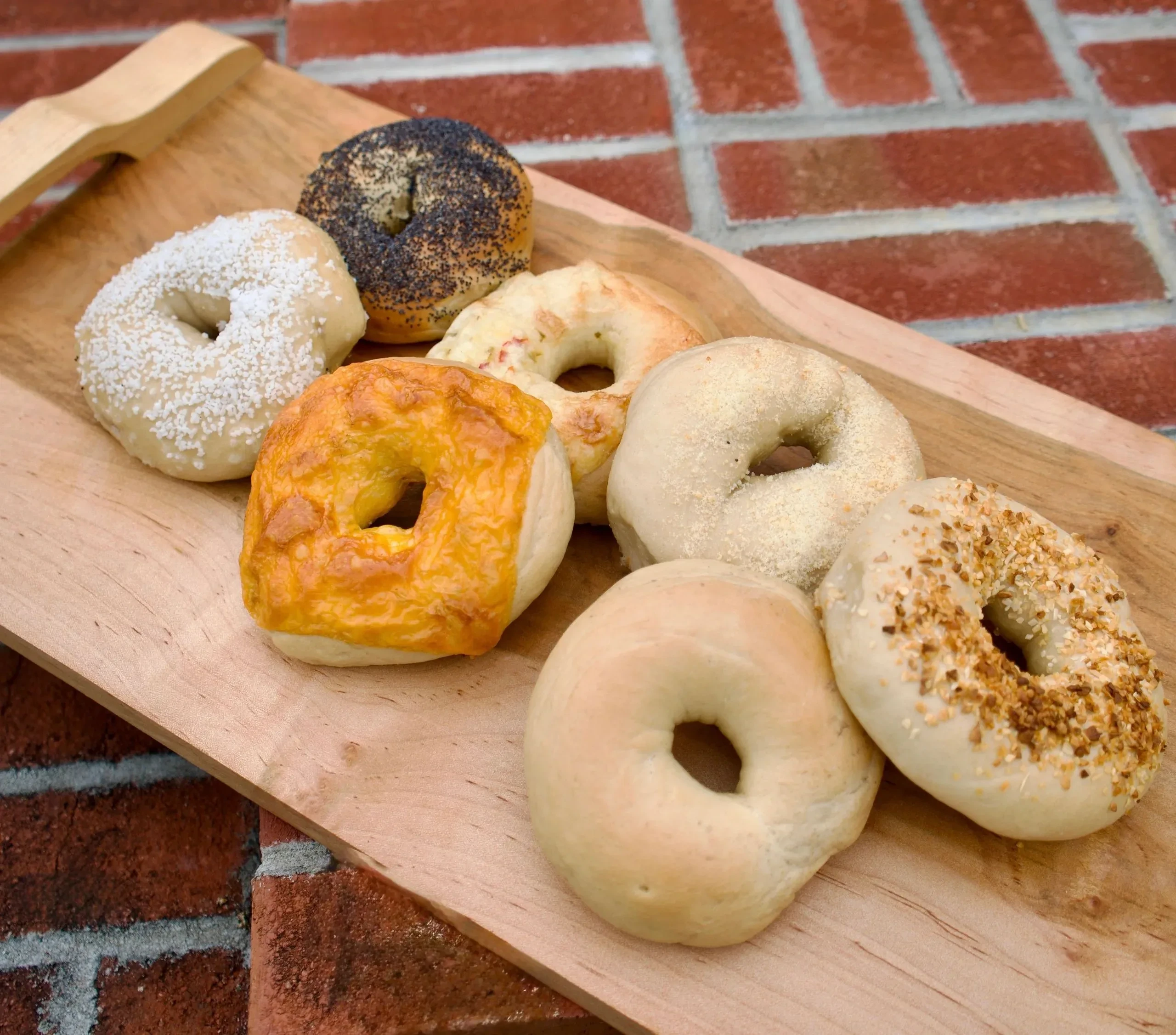 A board of New York style bagels made daily on the counter at Gemelli